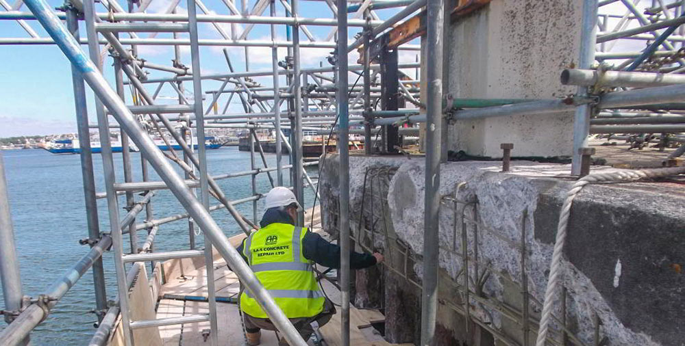 concrete devonport dockyardgun wharf scaffolding sea work team a&a ashton