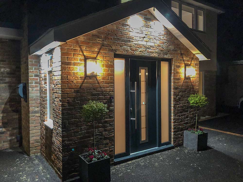 porch installation build lights dark brick insulation